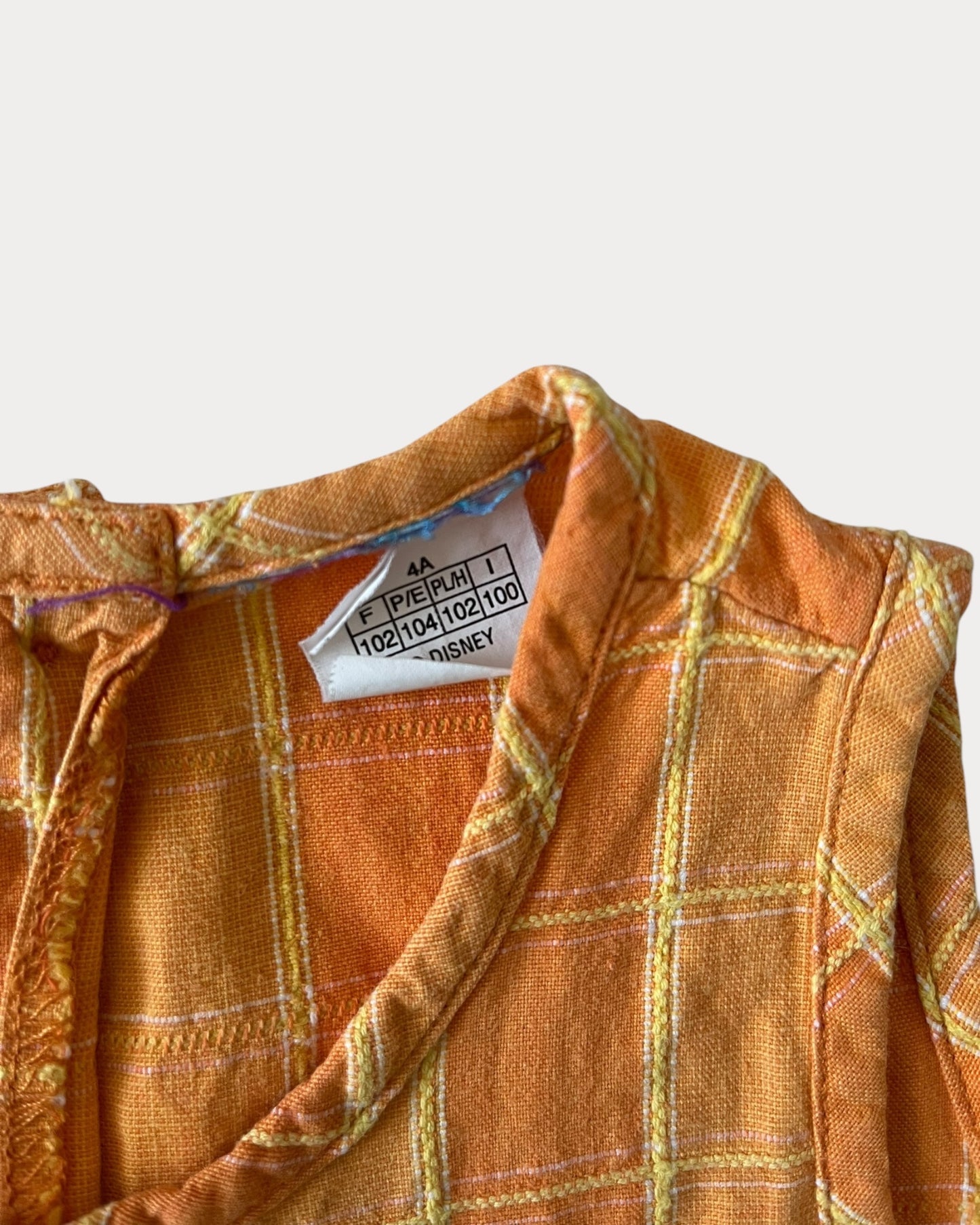 vintage Winnie The Pooh dress features a soft orange/yellow
