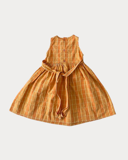 Vintage Winnie The Pooh dress features a soft orange/yellow 