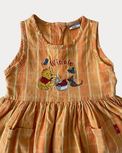 vintage Winnie The Pooh dress features a soft orange/yellow 