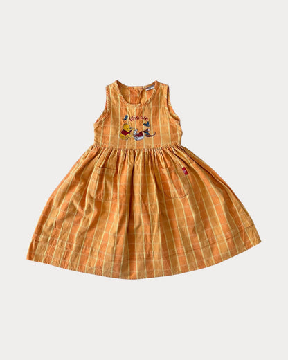 Vintage Winnie The Pooh dress features a soft orange/yellow 